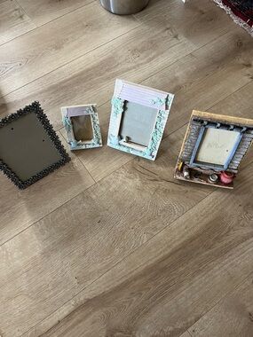 Set of Four Decorative Picture Frames in White, Cream, Black, and Brown Tones